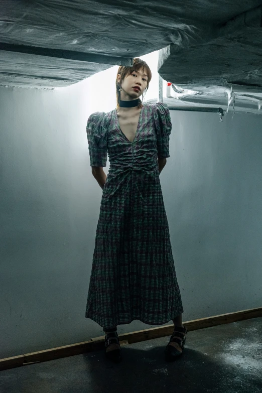 a woman is standing in a room with a neck tie