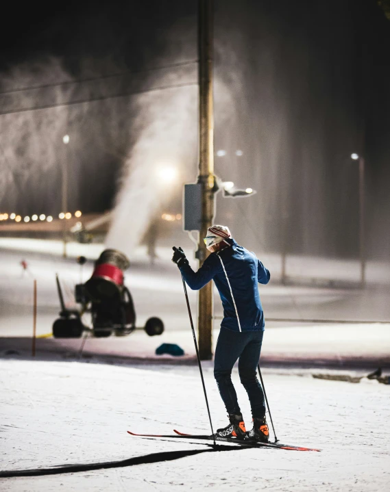 a person riding skis on a snowy surface