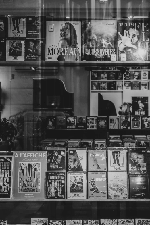 a store window with lots of posters on it