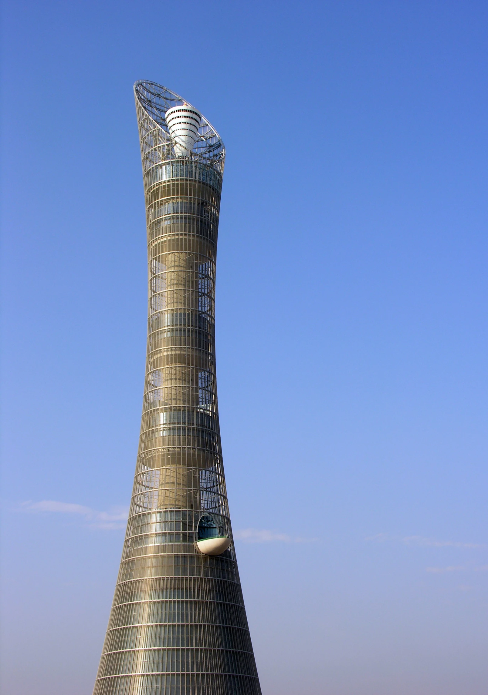 the large structure with a triangular shape sits alone on the beach