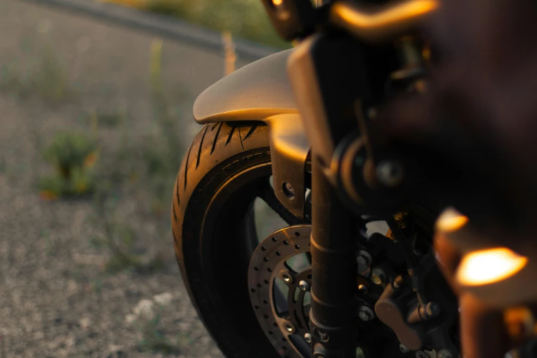 a motorcycle parked in the street with lights on