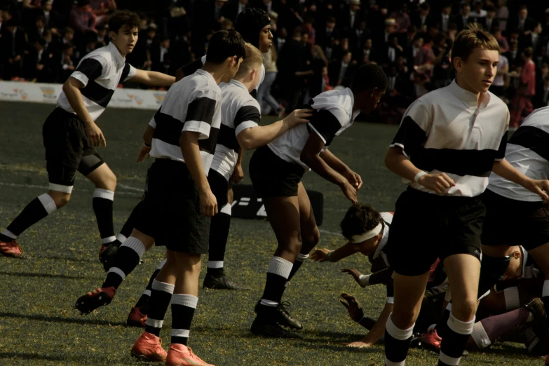 soccer players with referee's hands in a game