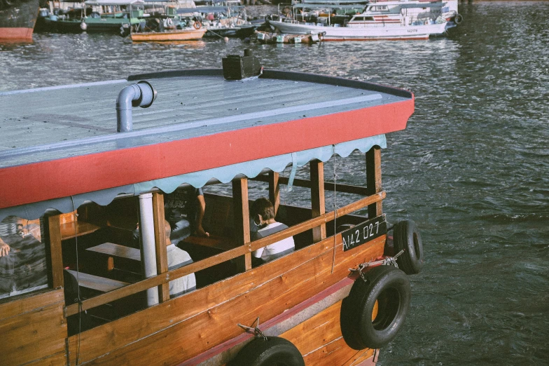 the boat has two rows of people sitting inside