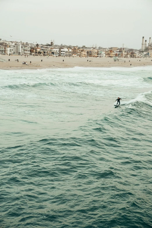 a man is surfing in the waves of the ocean