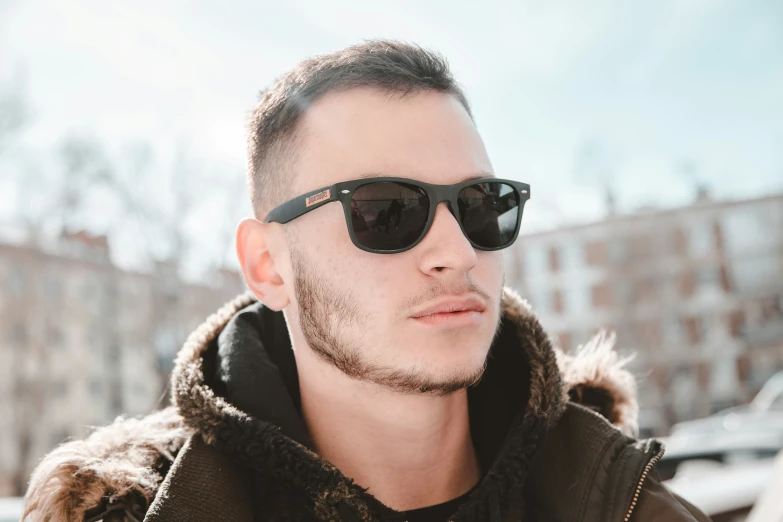 a man with sunglasses on is staring at the camera