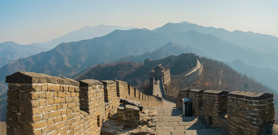 a large stone wall on top of a mountain