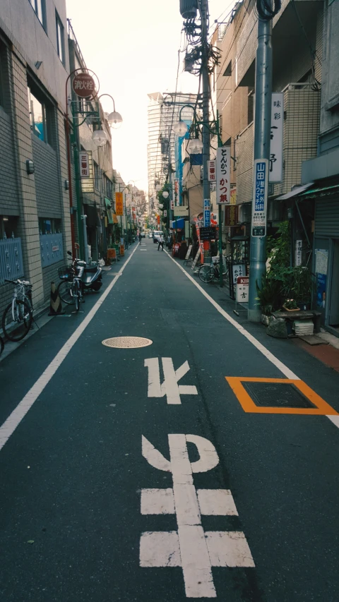 this is an empty street with buildings in the background