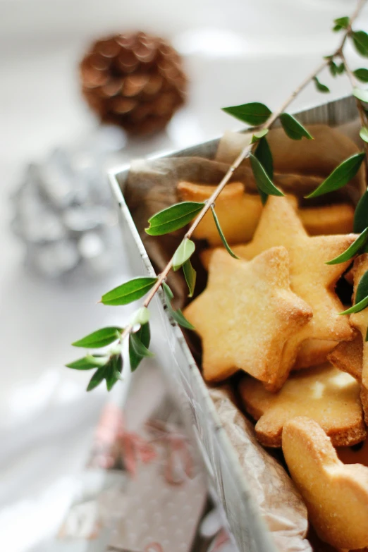 some cookies with green leaves on a table