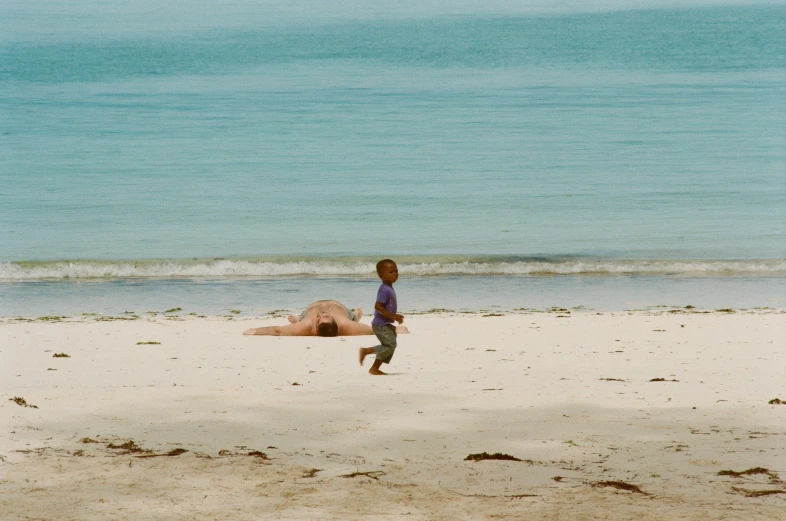 a  is on the beach playing with his toy