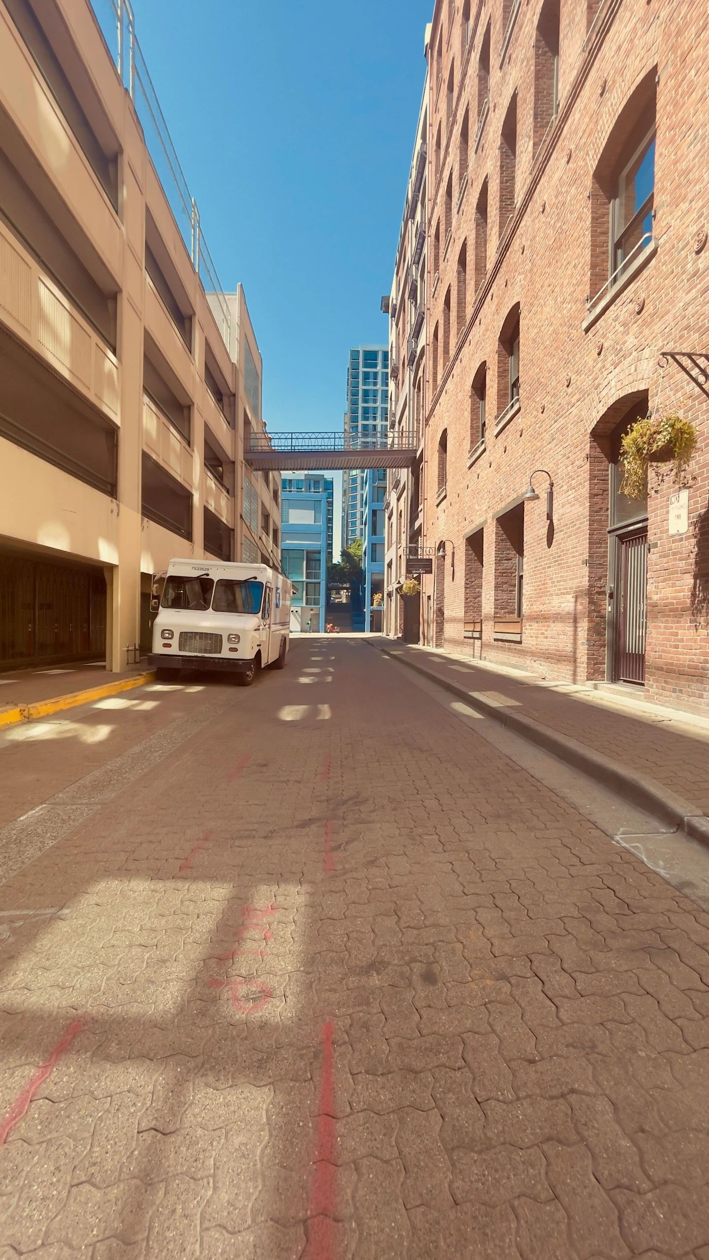 an empty street and street sign on both sides