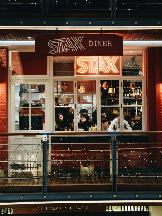 restaurant with people eating in it during the night