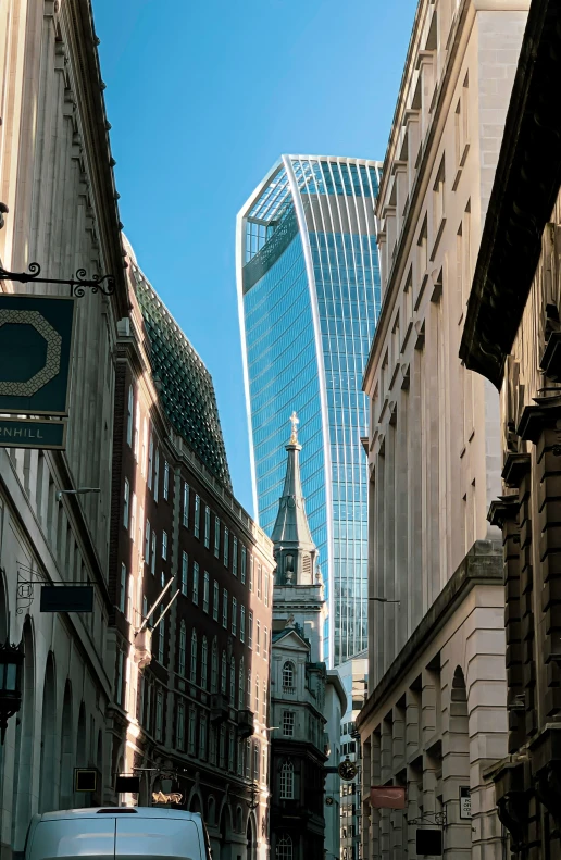 the street in the city is lined with tall buildings