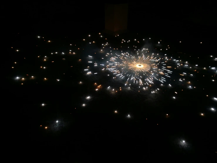 fireworks lit up the night sky with large and small stars