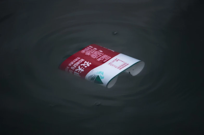 an tube of alcohol floating on top of water