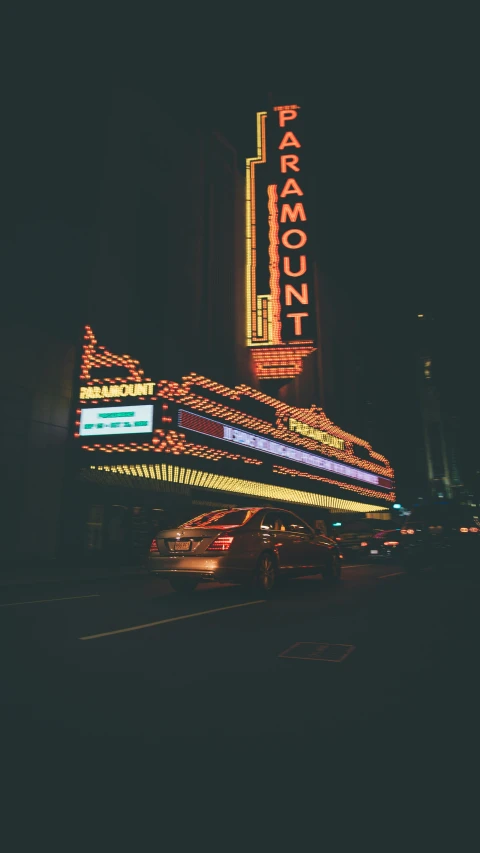 a very large sign lit up at night