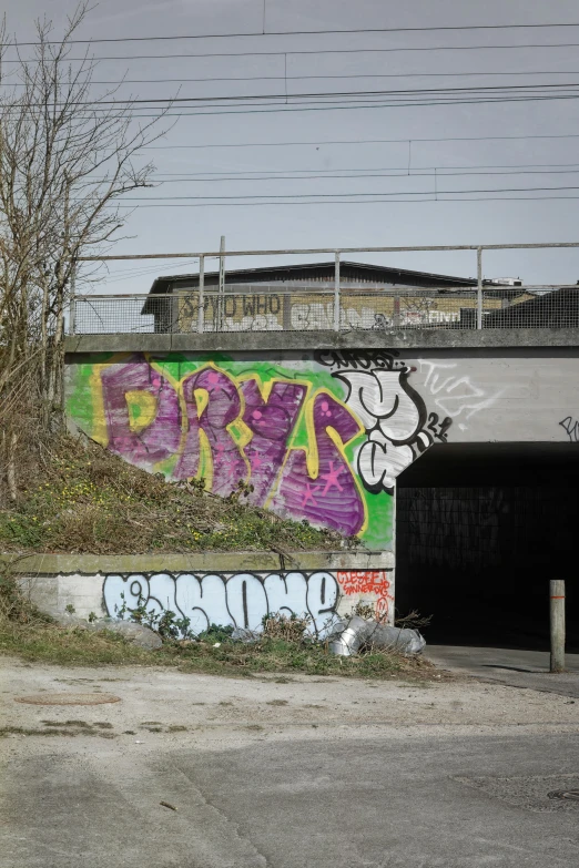 graffiti on a cement structure near a street