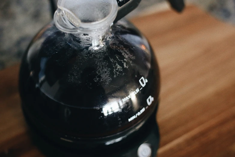 the handle of an electric teapot on a table