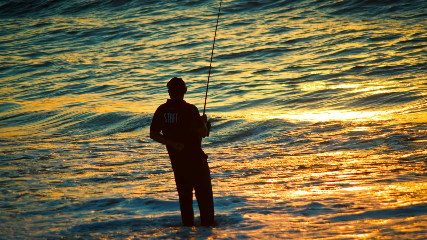 the fisherman has fishing poles in his hand