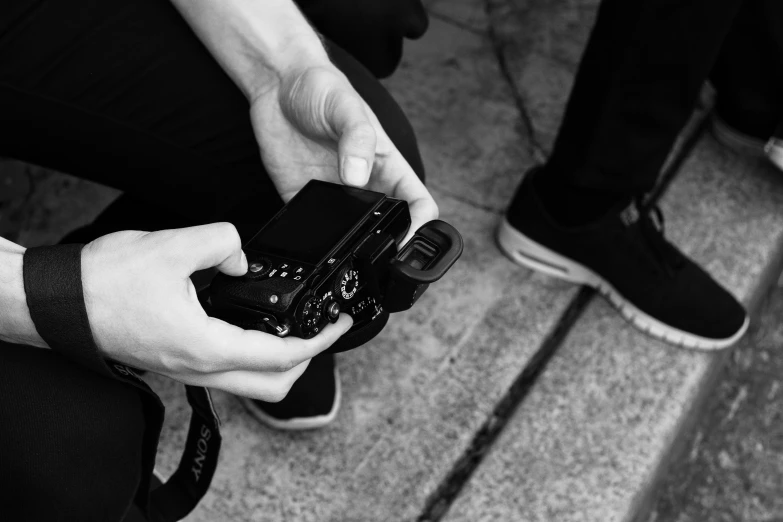 a man holding a camera in his hands