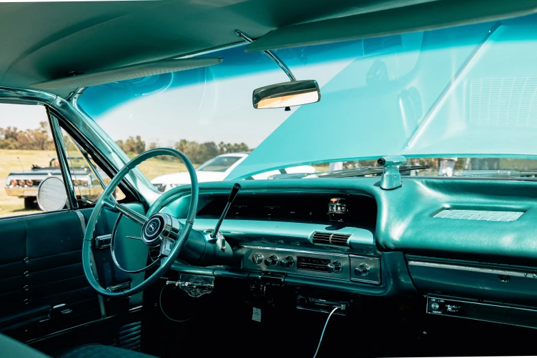 the interior of an older model chevrolet car