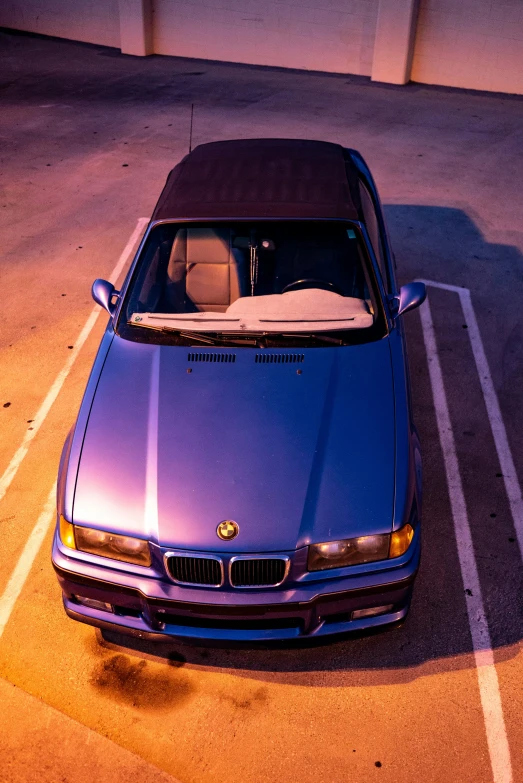 a bmw is parked in a parking lot