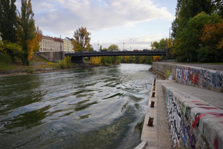 a bridge over a river next to a building