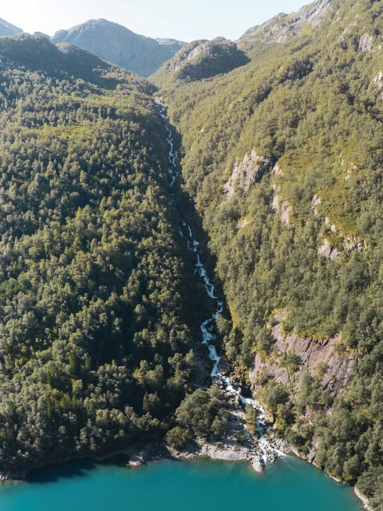 an aerial view of the valley near mountains