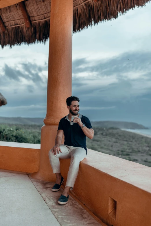 a person on a cell phone near an umbrella