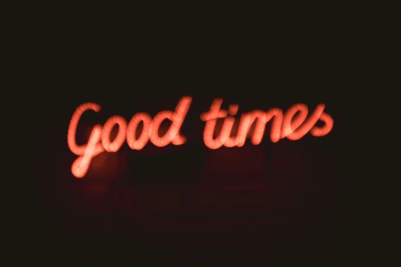 a picture of the words good times illuminated by neon lights