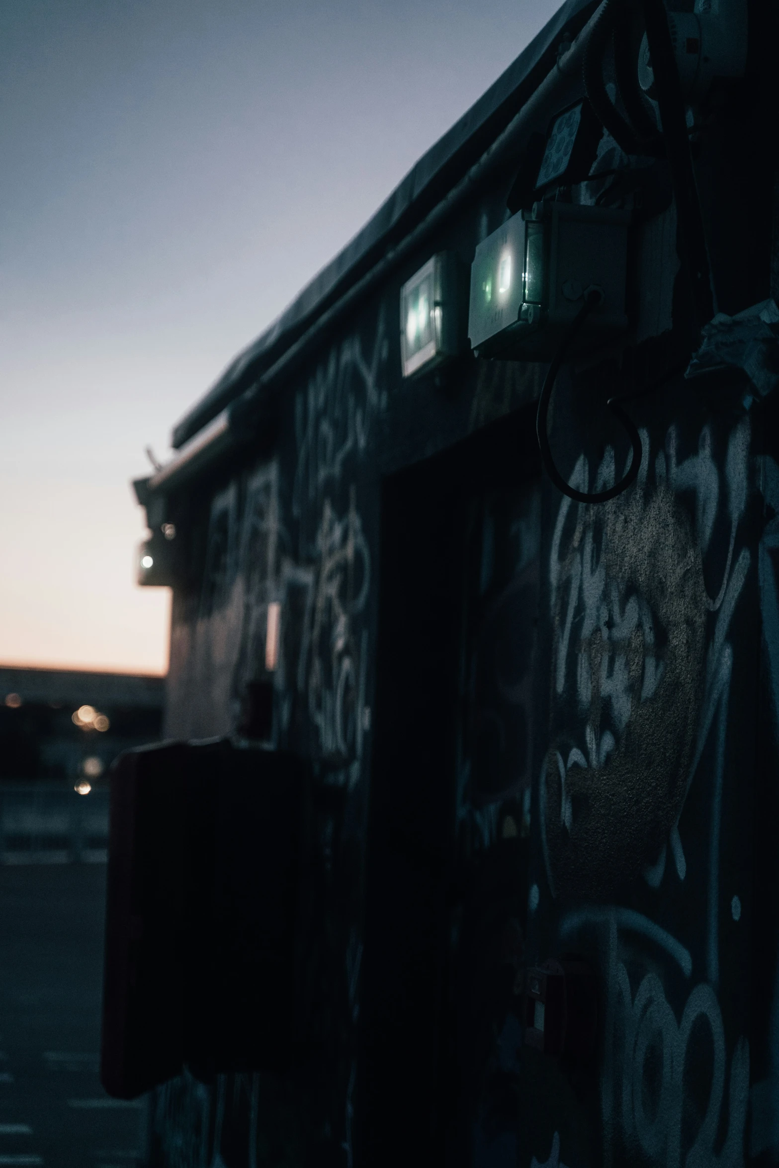 a train car is covered in graffiti next to a building