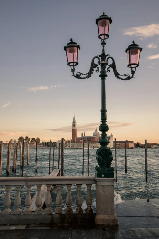 a street light in the middle of a body of water