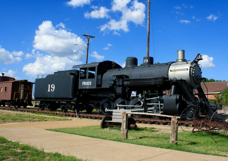 an old model black train at a museum