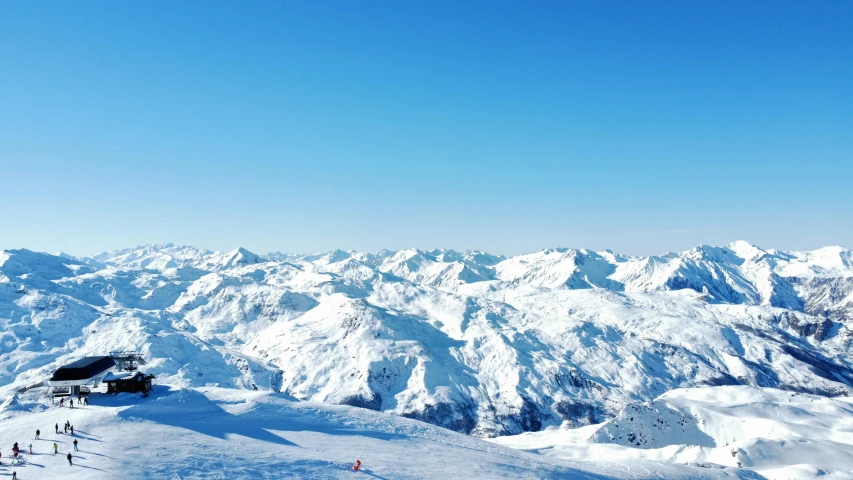 view of people skiing down a snowy mountain