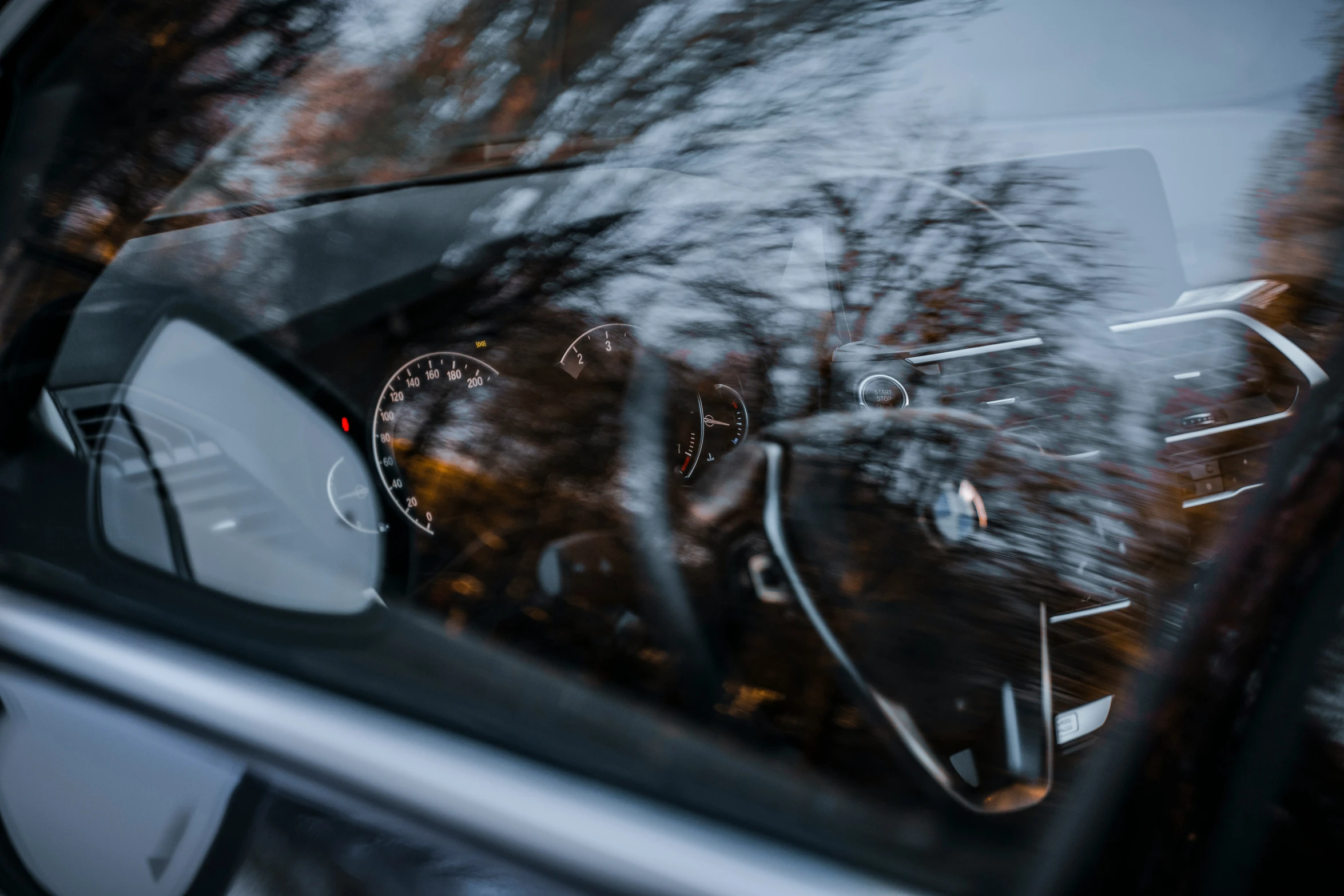 the dashboard, dash and dashboard are seen through a vehicle window