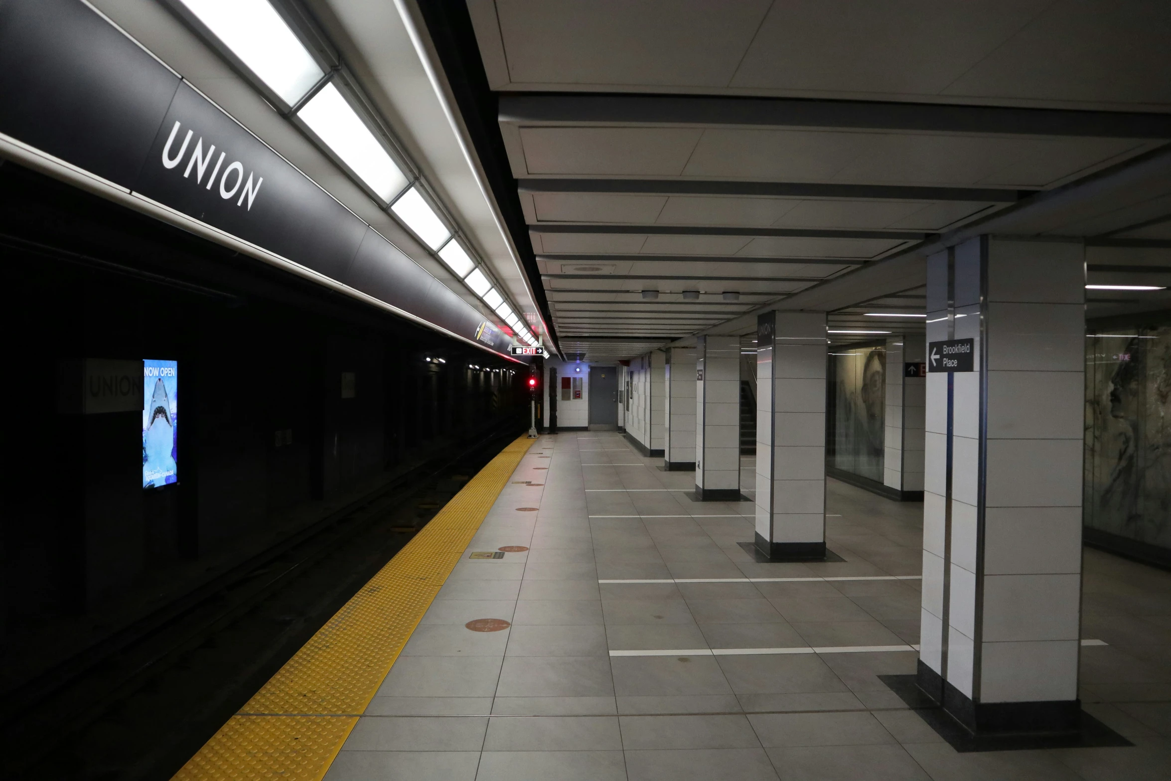 several empty public bathrooms are on a dark and stormy day