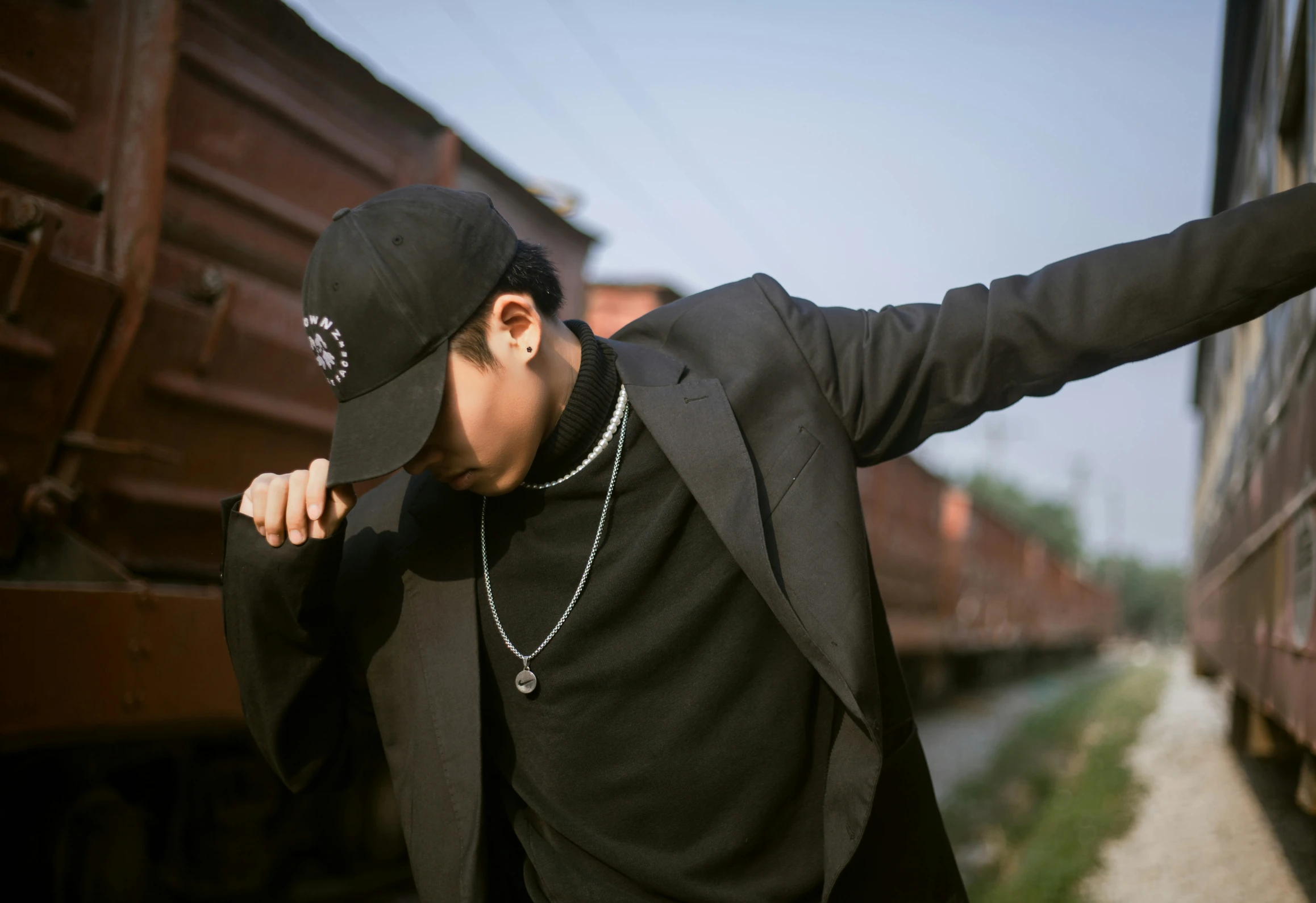 a man leans out of his train as he takes off