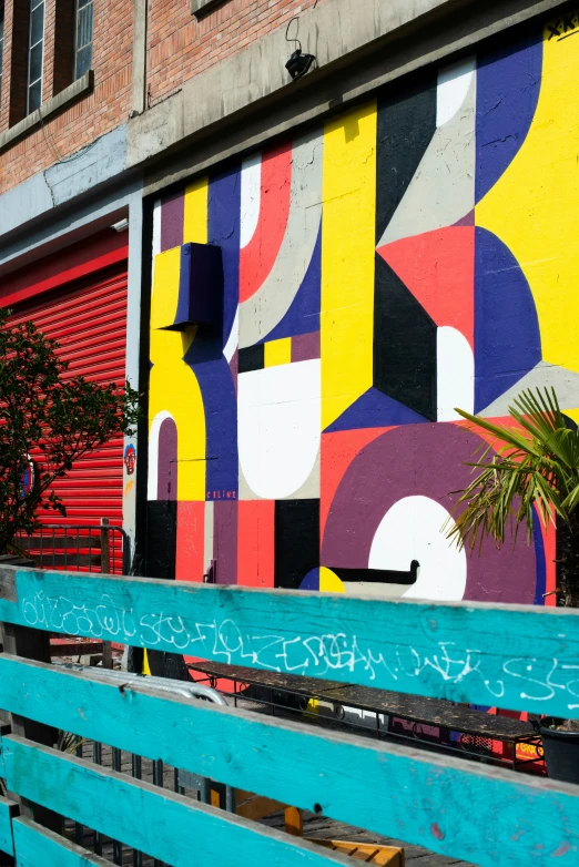 a colorful building painted by an expert muralist