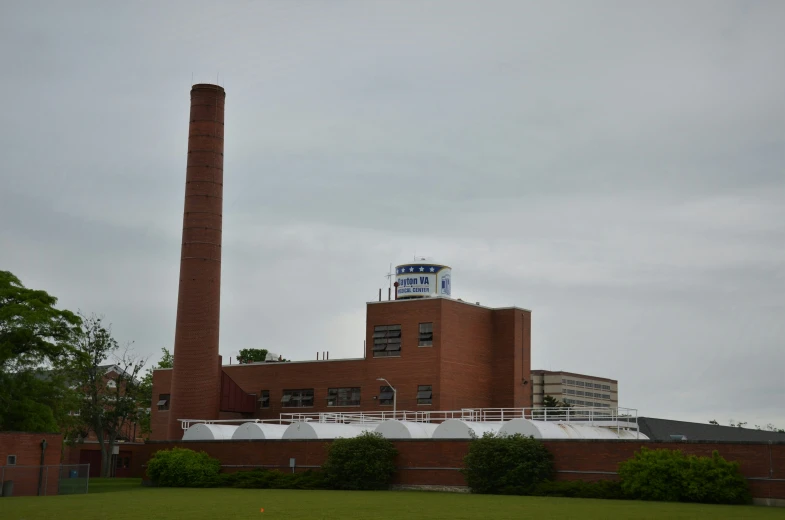 large brick building sitting behind a red brick building