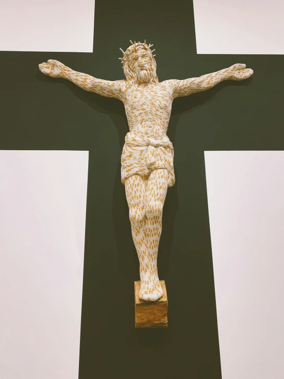 a decorative cross on top of a wall