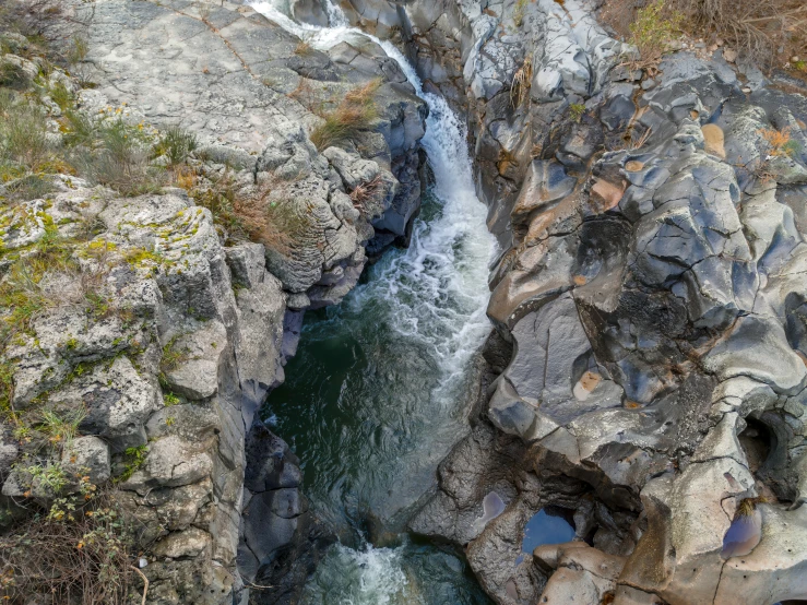 the waterfall has a large amount of water in it