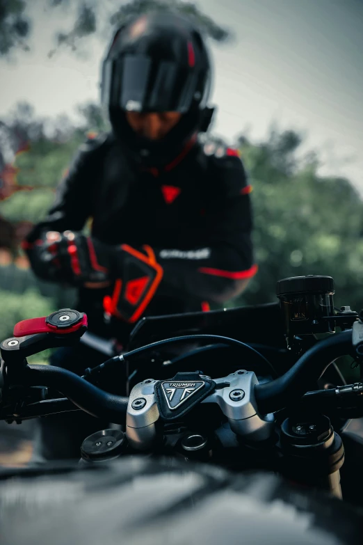 the helmet and a bike helmet on the front of a motor bike