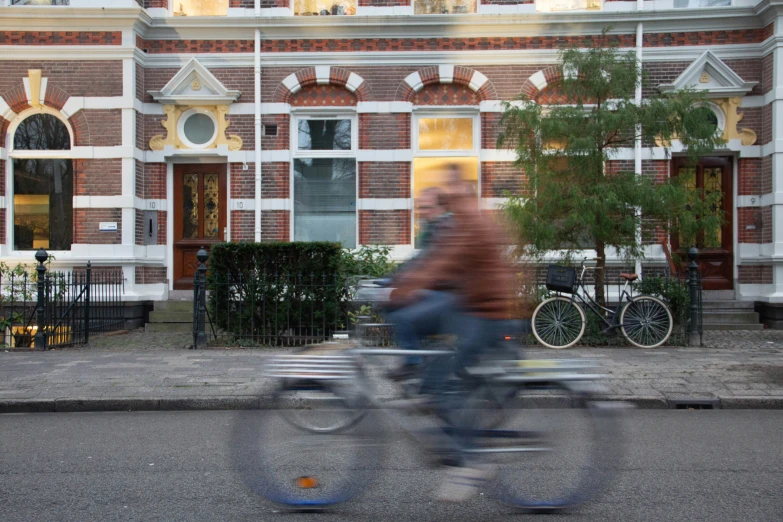 an older man riding a bike through the city