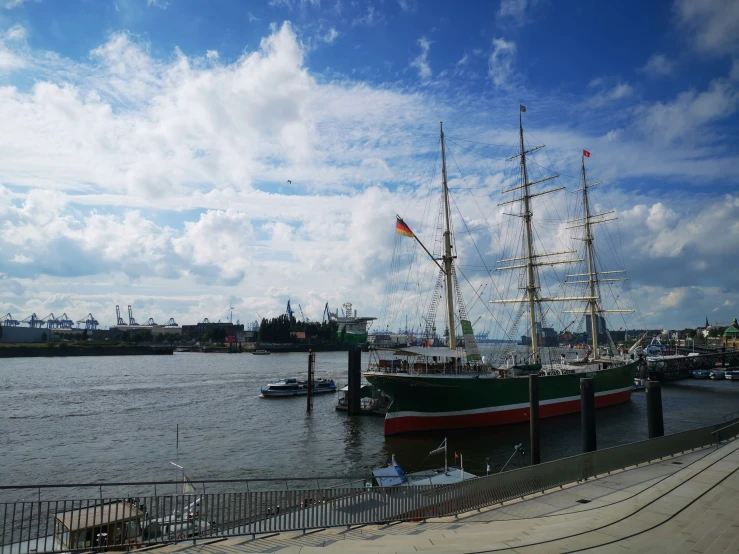 the boats are in the water by the pier