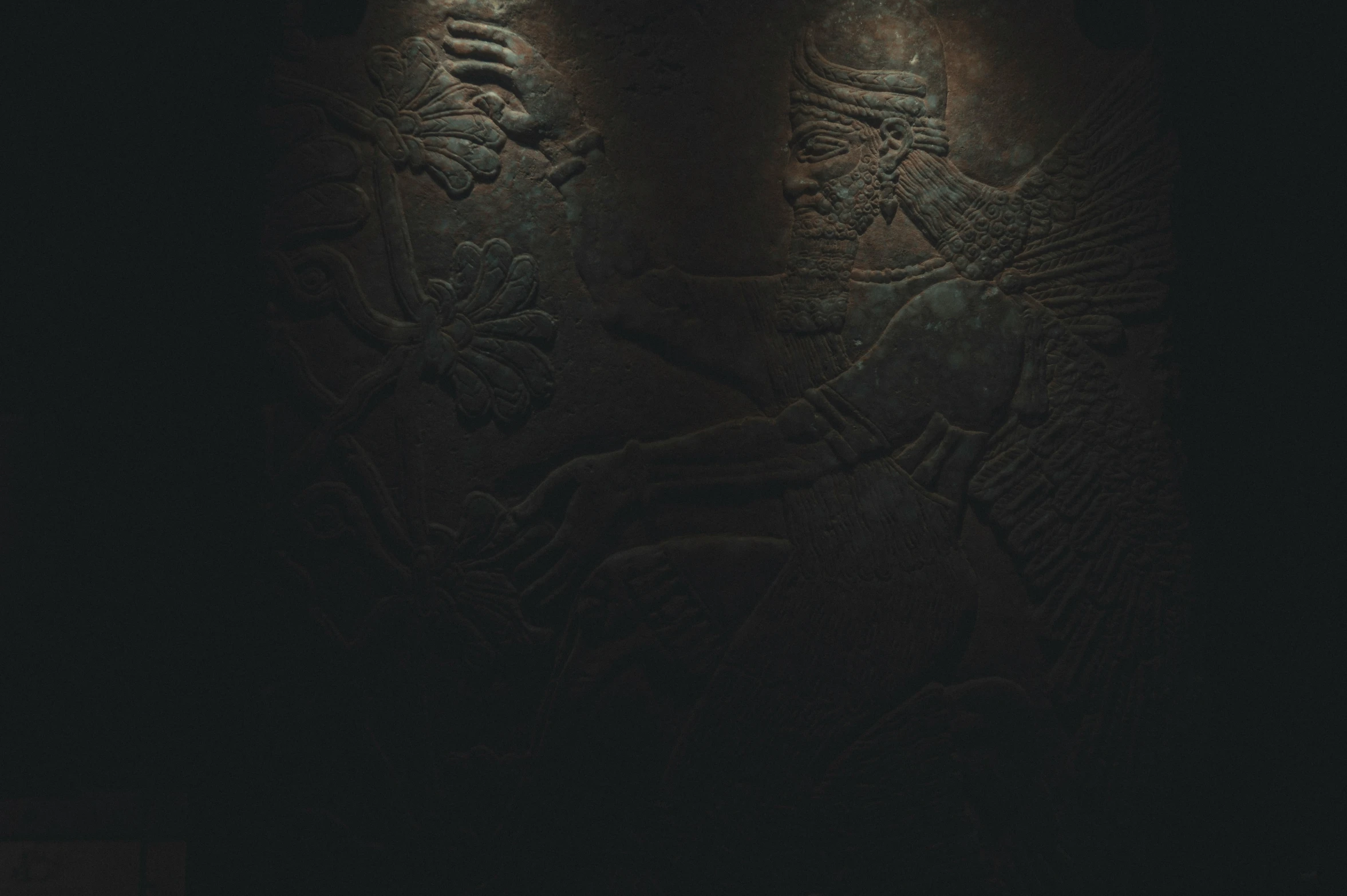 an image of artistic carvings in the dark