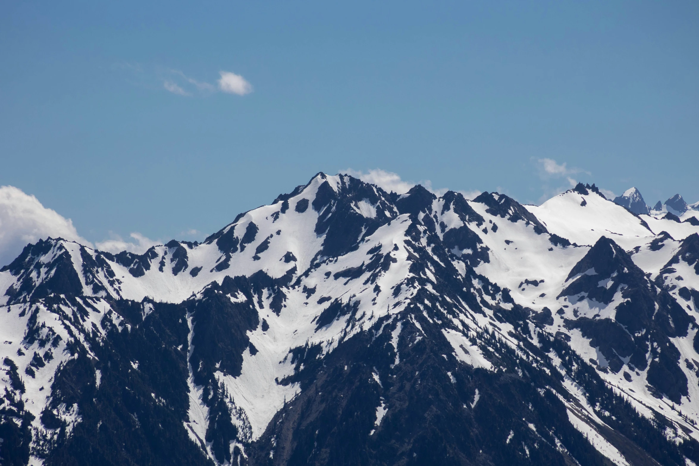 two planes on the top of a snow covered mountain