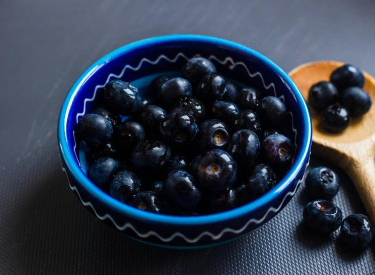 there are blueberries in the blue bowl