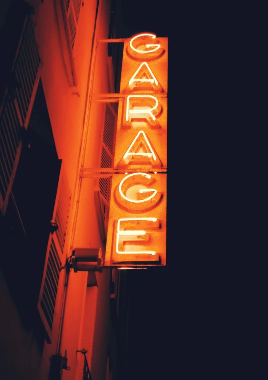 neon sign and lit building in night time