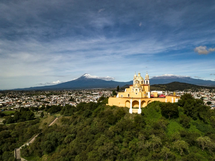 the city skyline, from atop the hills, with a church on top