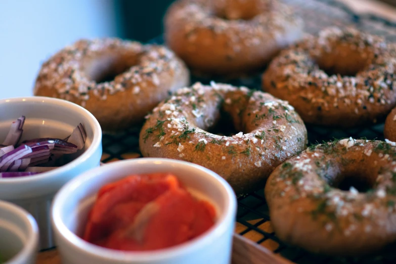 several doughnuts and bowls on a rack