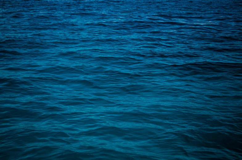 a large body of water with some waves on it